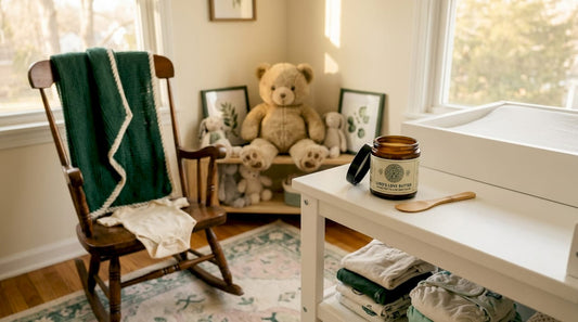 Open jar of grass-fed tallow baby balm on nursery table