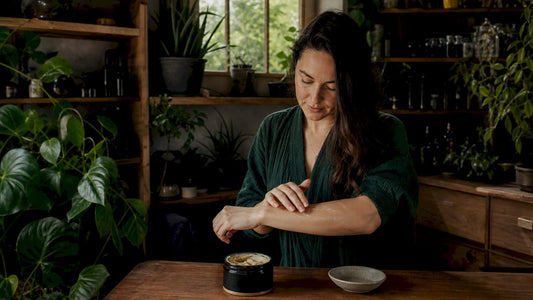 Woman applying animal-based skincare balm
